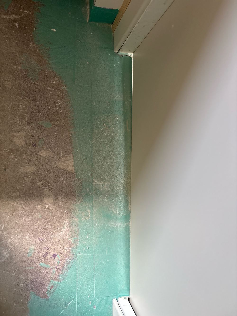 Water stop angle missing under the ensuite doorway before tiling, found during a waterproofing inspection in Beveridge
