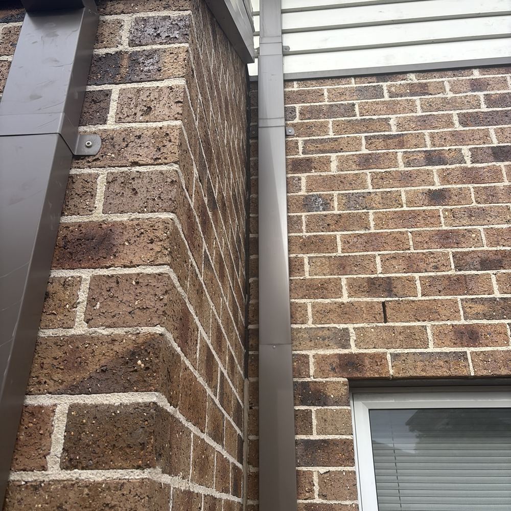 Open gaps in the stone veneer letting moisture reach the wall behind, found during a defect investigation inspection in Pascoe Vale