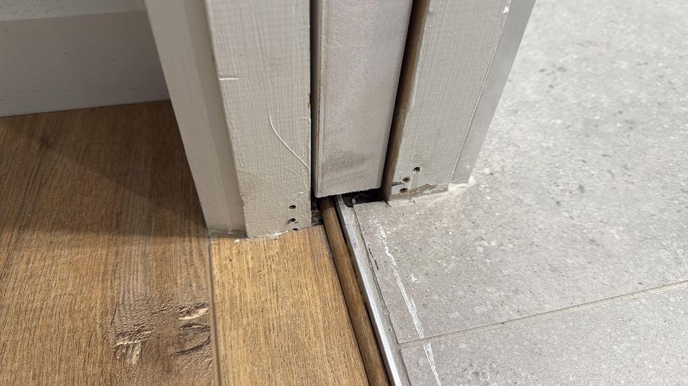 Water stop return missing at the base of the bathroom doorway, found during a defect investigation inspection in Pascoe Vale