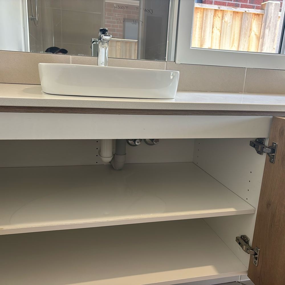 Basin waste leaking under the vanity at practical completion, found during a pre-handover (PCI) inspection in Beveridge