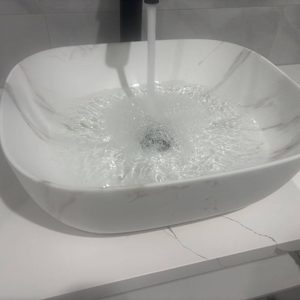 Basin waste partly blocked and holding water at handover, Beveridge