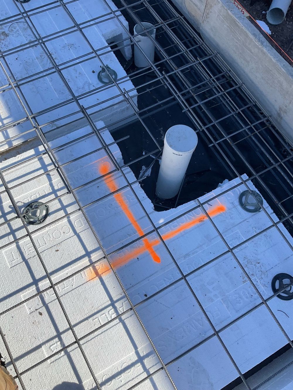 Extra bars missing around service penetrations where the top mesh is cut, found during a slab pre-pour inspection in Beveridge